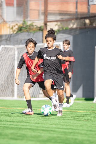 Players competing on the pitch at The Showcase, photographed by @sh0tby_tb